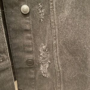 Black denim distressed jacket with rhinestone fringe